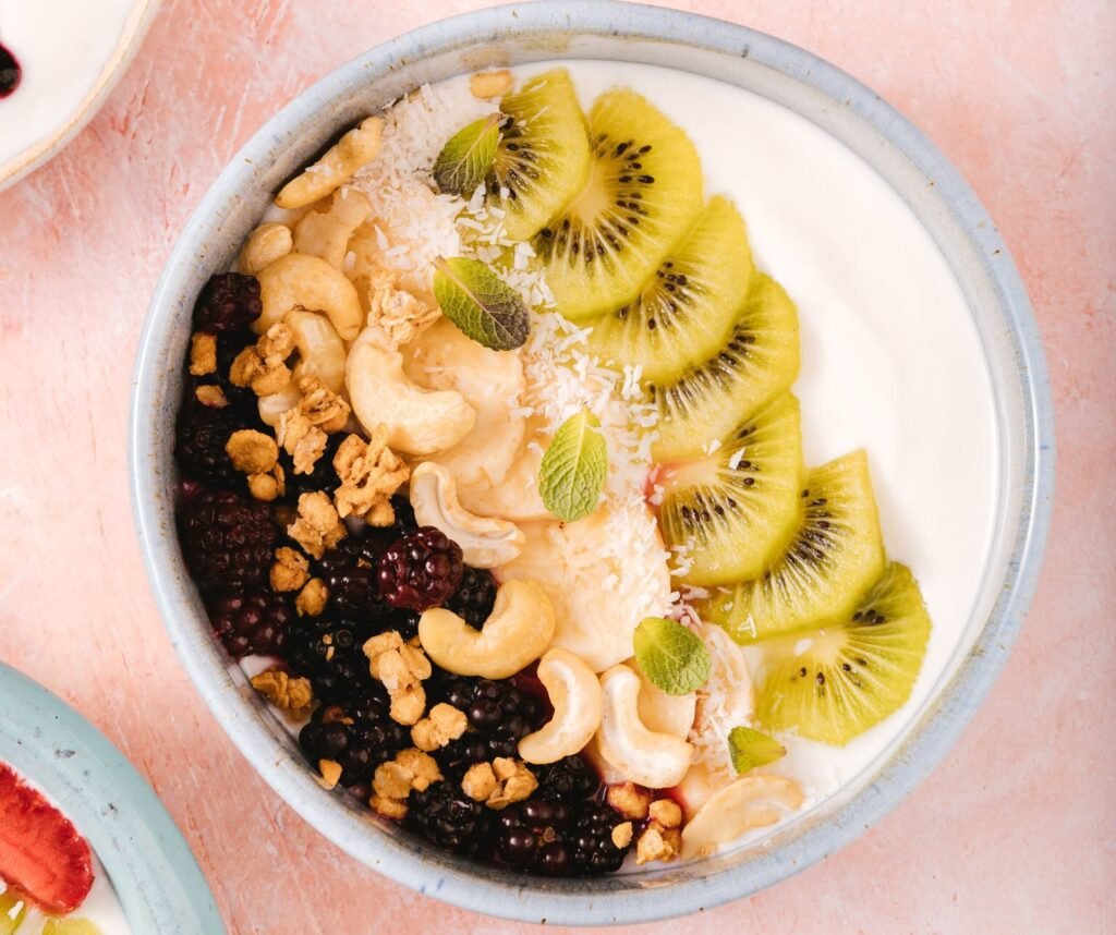 Top gut-healthy foods: berries, yogurt, vegetables, and nuts.